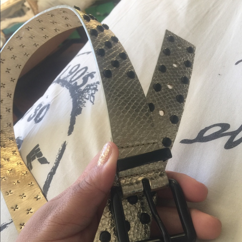 Gold belt with black dominoed studs